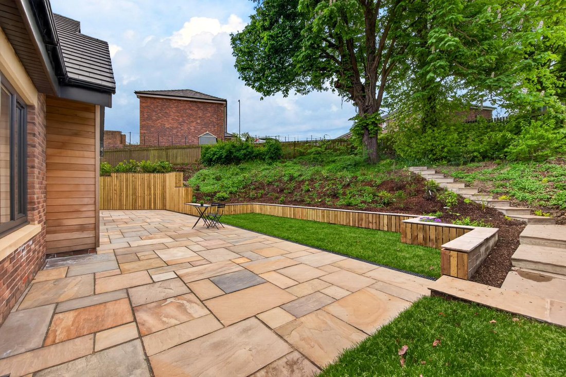 Indian sandstone patio with garden views.